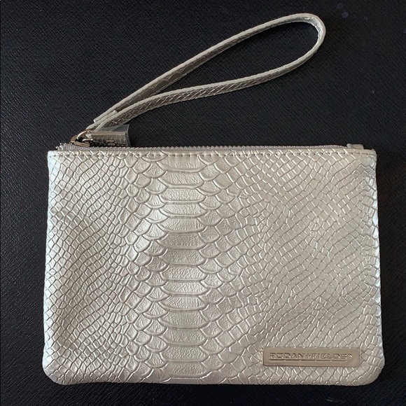 Rodan + Fields Handbags - NEW Rodan + Fields Silver Textile Wristlet